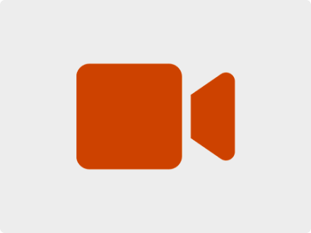 Das Bild zeigt eine orange·farbene Video·kamera. Die Video·kamera ist das Symbol für: Video·gespräch.