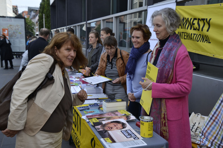 woman at the amnesty international booth