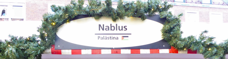 Schild der Nablus Bude am Markt der Partnerstädte