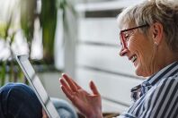 Senior woman using digital tablet at home. The use of technology by the elderly.